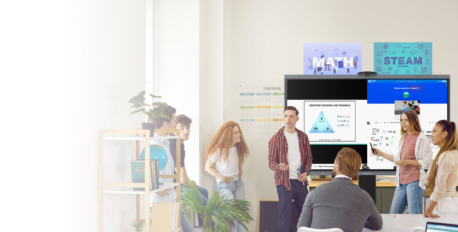 Group of people in a modern office setting with technology displays.